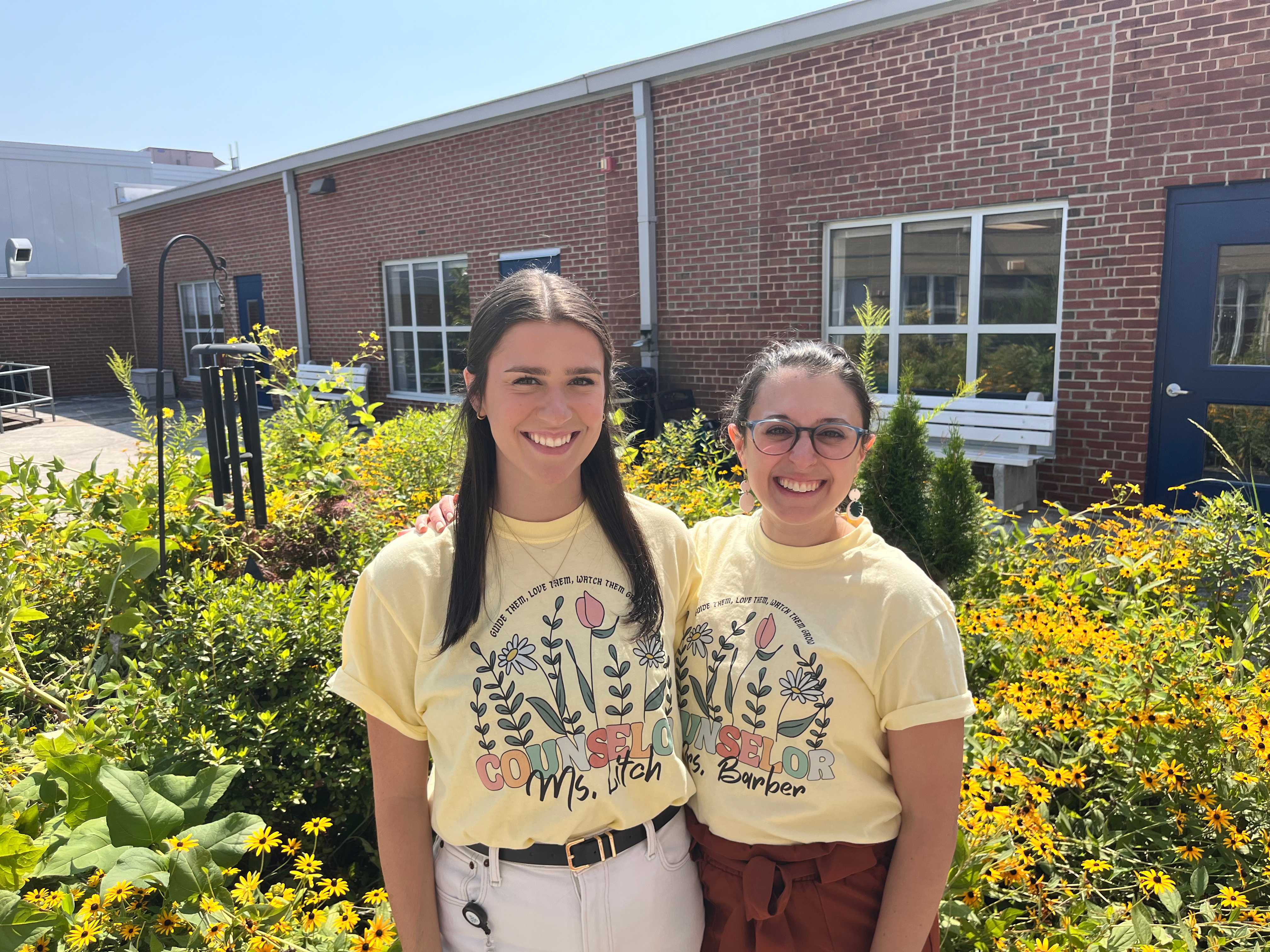 counselors smile in the garden